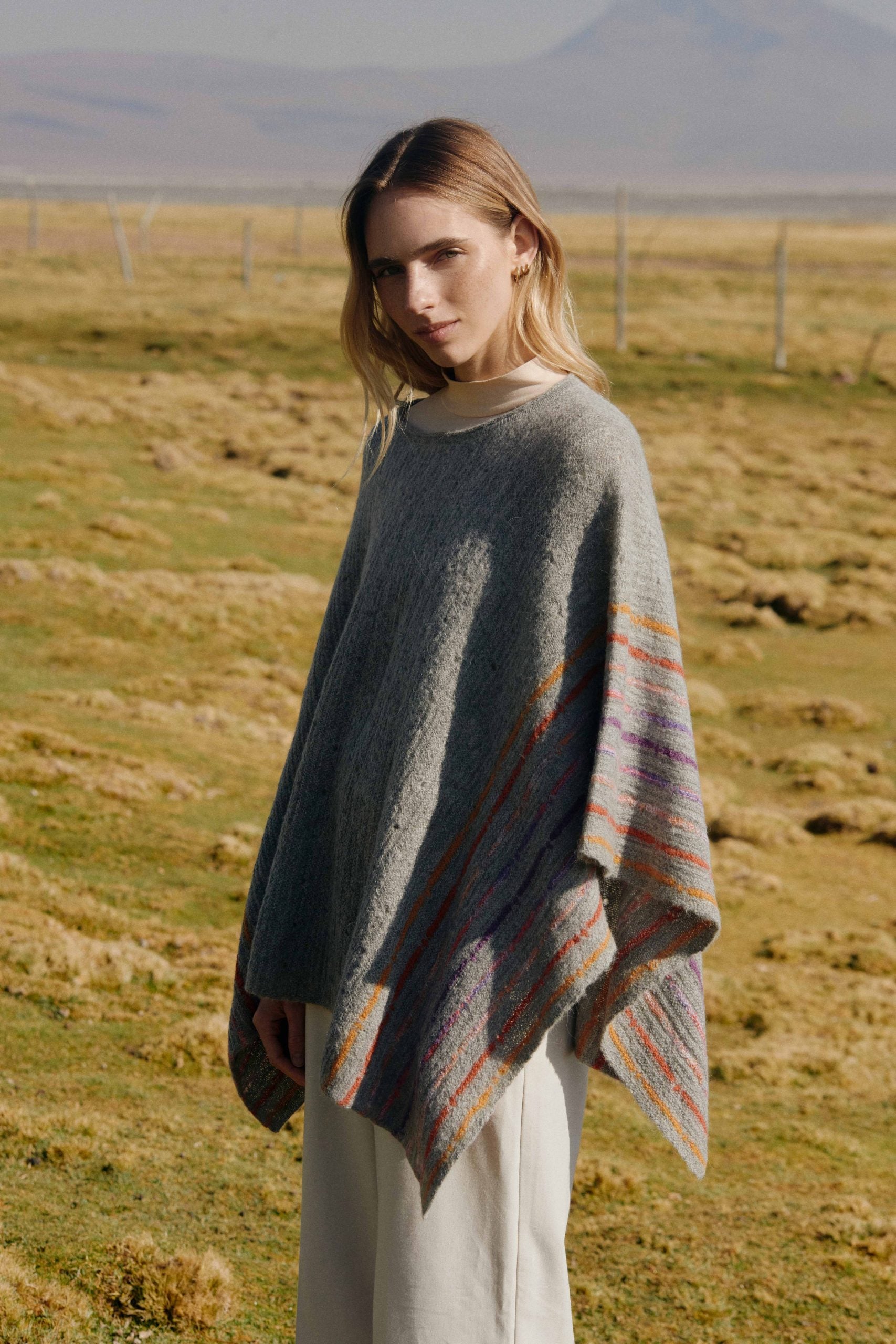 Alpaca poncho with striped pattern